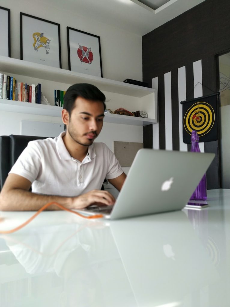Young entrepreneur working on a laptop representing FinTech innovation in Ireland