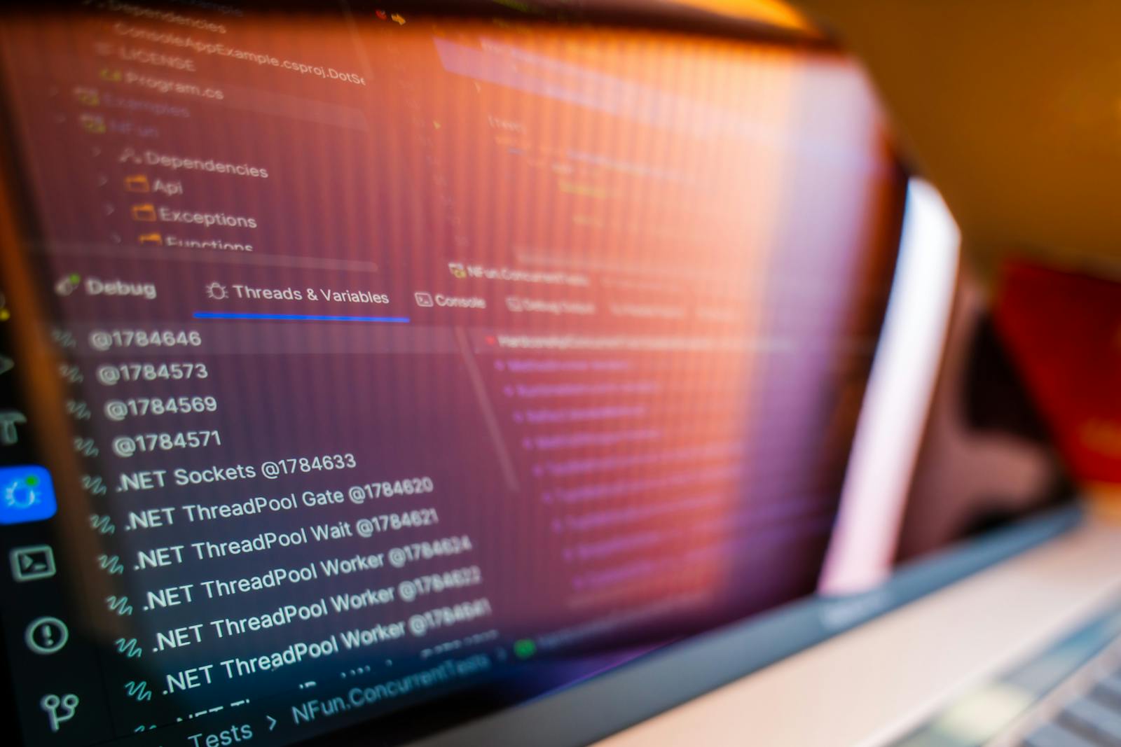 Focused view of a computer screen displaying code and debug information.