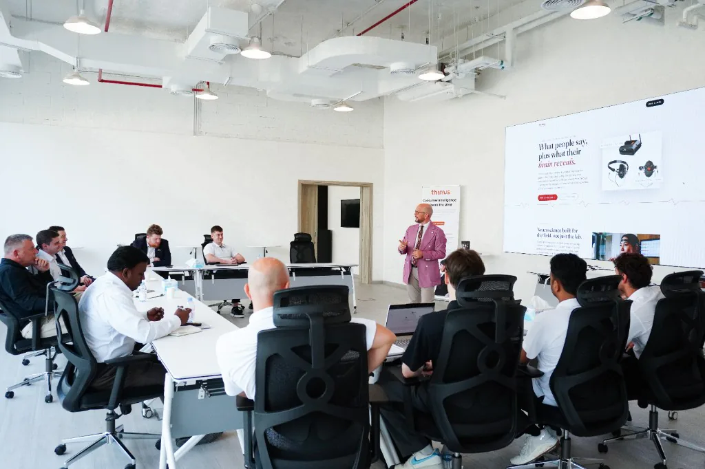 Mario Ubiali presenting Decoding Desire to the room at our offices in Abu Dhabi, with T-box on screen